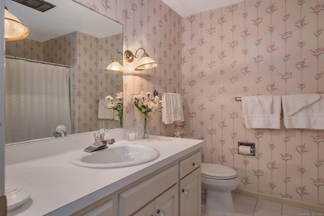 full bath with tile patterned floors, toilet, and wallpapered walls