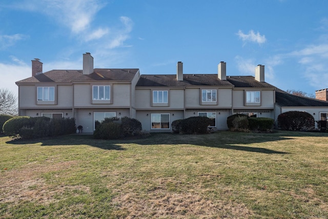 back of house with a yard