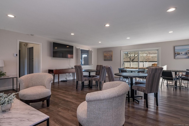 dining room with recessed lighting and dark wood-style flooring