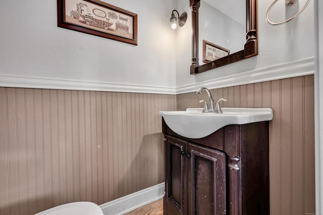 bathroom with vanity and wainscoting