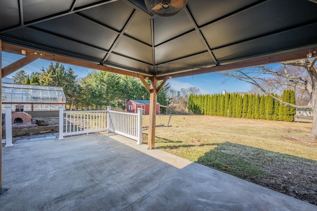 view of patio / terrace with a storage shed and an outdoor structure