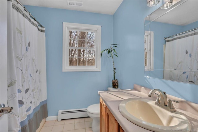 bathroom featuring toilet, vanity, visible vents, baseboard heating, and tile patterned floors