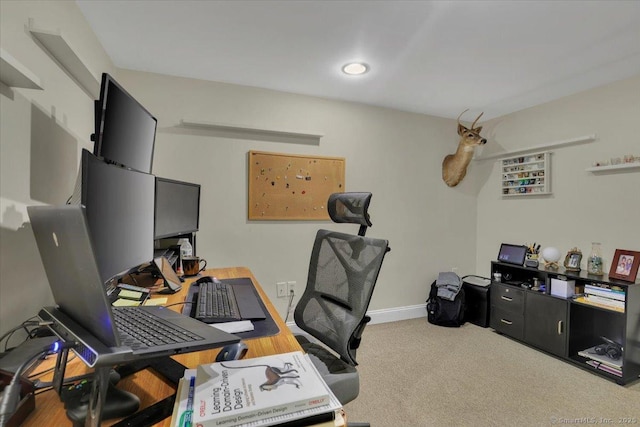 carpeted office with baseboards