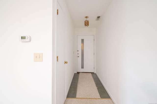 hallway featuring baseboards