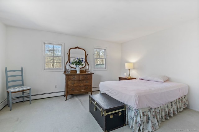 carpeted bedroom with a baseboard radiator and multiple windows