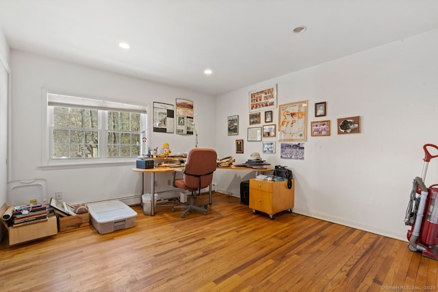 office area featuring recessed lighting, baseboards, and light wood finished floors