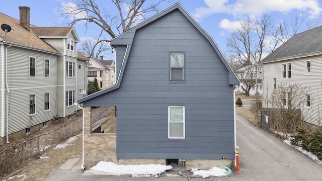 view of home's exterior featuring fence