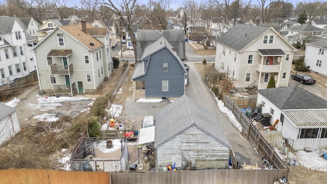 birds eye view of property with a residential view