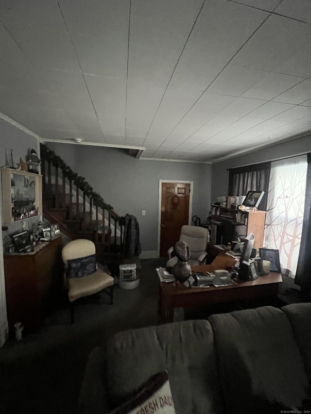 living room with stairs and ornamental molding