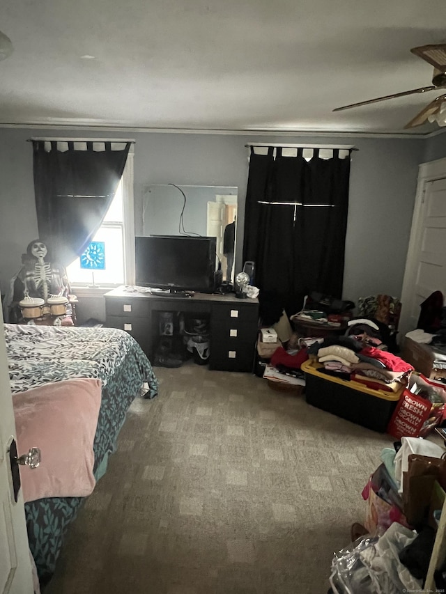 carpeted bedroom with a ceiling fan