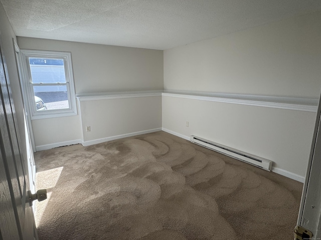 carpeted spare room featuring a textured ceiling, a baseboard radiator, and baseboards