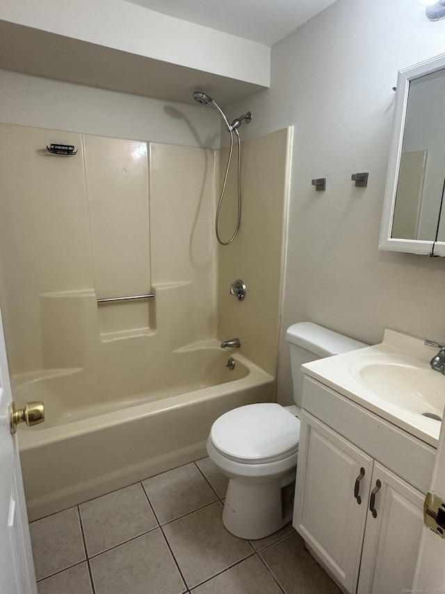 full bath featuring tile patterned flooring, toilet, vanity, and shower / tub combination