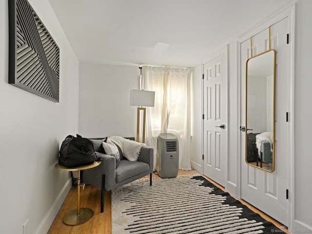 living area featuring wood finished floors and baseboards