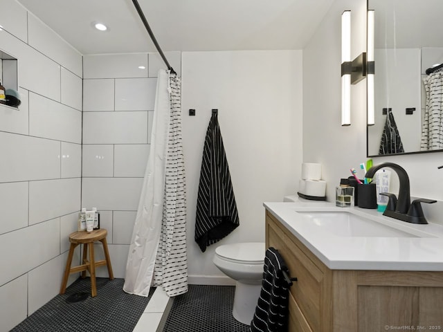 full bath featuring toilet, curtained shower, vanity, and tile patterned floors