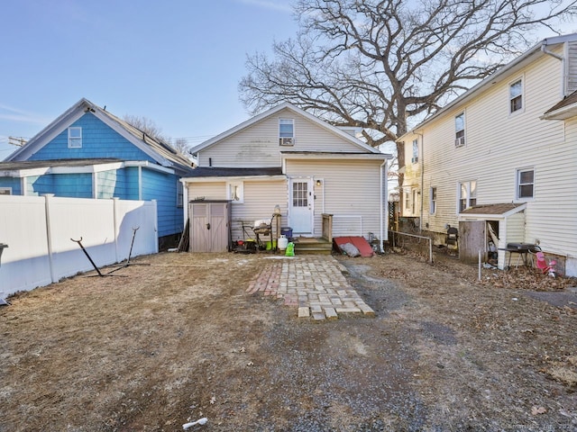 back of property featuring fence