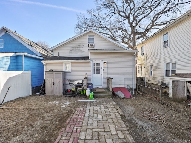 back of property with fence