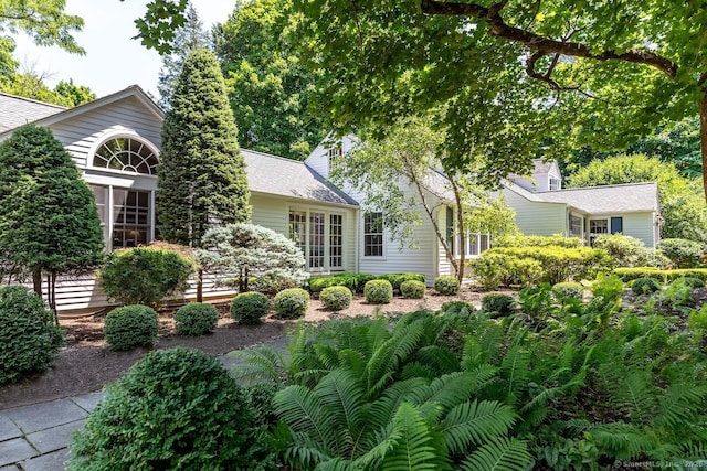 view of front of house with roof with shingles