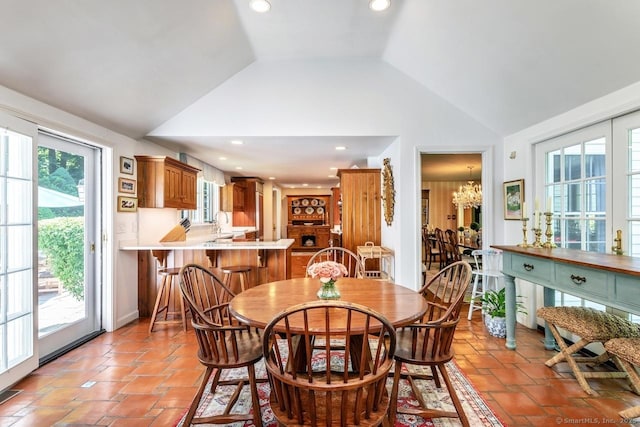 dining room featuring a chandelier, lofted ceiling, visible vents, and recessed lighting