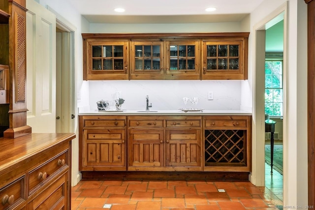 bar featuring recessed lighting and a sink