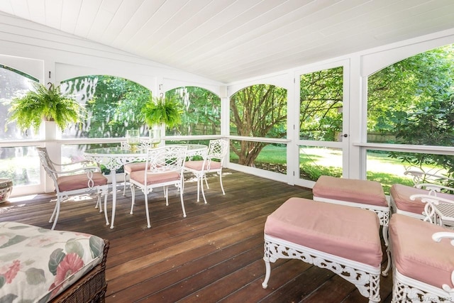 sunroom with lofted ceiling and wooden ceiling