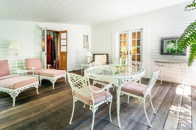 sunroom / solarium featuring french doors