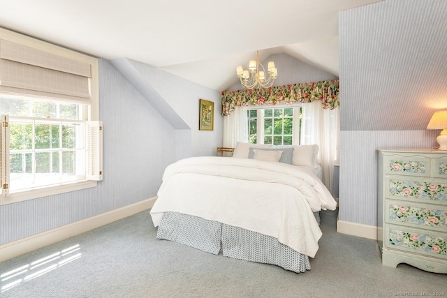 bedroom featuring vaulted ceiling, carpet floors, wallpapered walls, and a notable chandelier