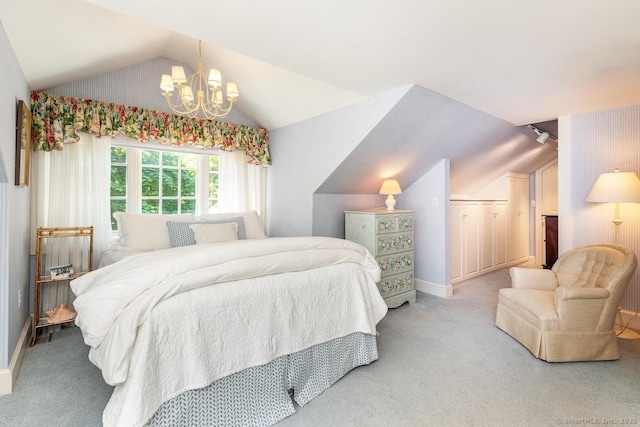 bedroom featuring lofted ceiling, baseboards, a notable chandelier, and carpet