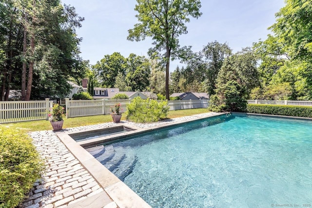 view of swimming pool featuring a fenced in pool, a fenced backyard, and a yard