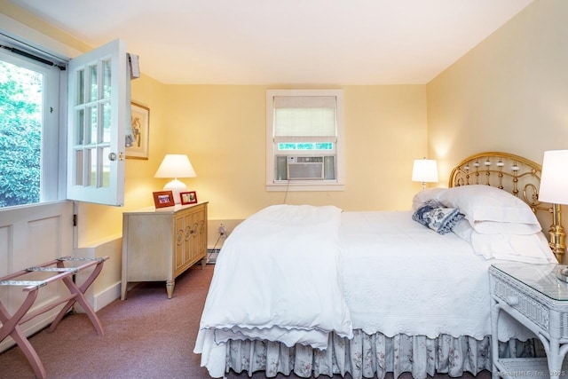 bedroom featuring carpet floors, baseboard heating, cooling unit, and baseboards