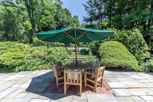 view of patio featuring outdoor dining area