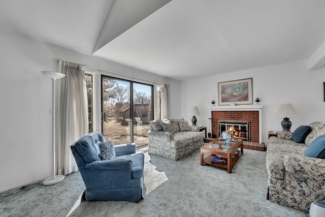 living area with carpet floors and a brick fireplace