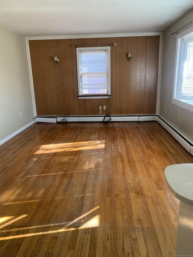 empty room featuring dark wood-style flooring and baseboards