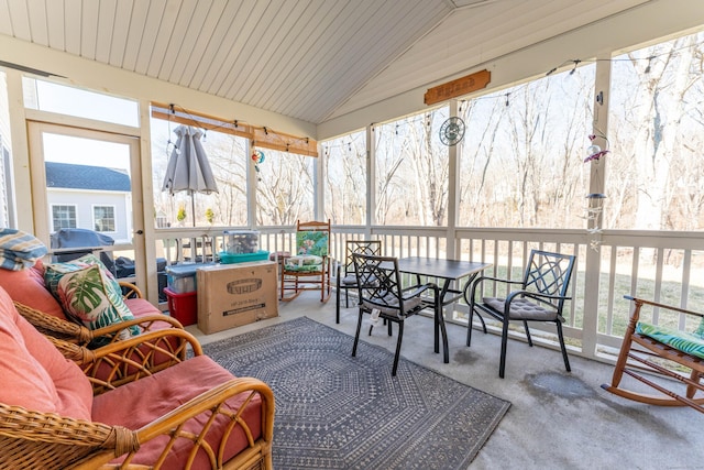 sunroom with a wealth of natural light and vaulted ceiling