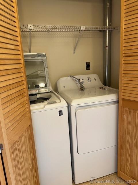 laundry area featuring laundry area and washer and dryer