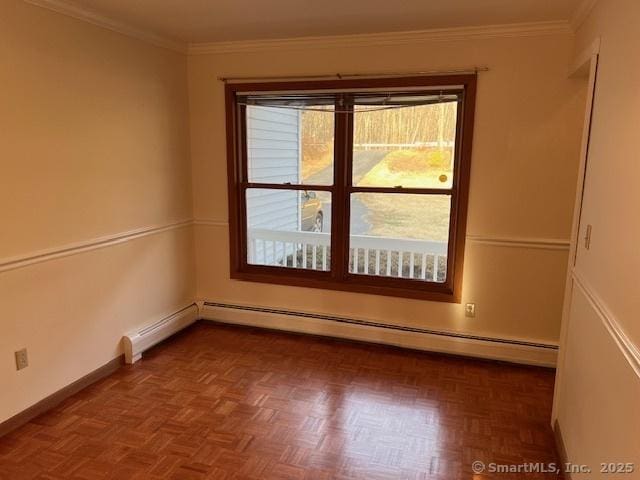 empty room featuring a baseboard radiator, baseboards, and ornamental molding