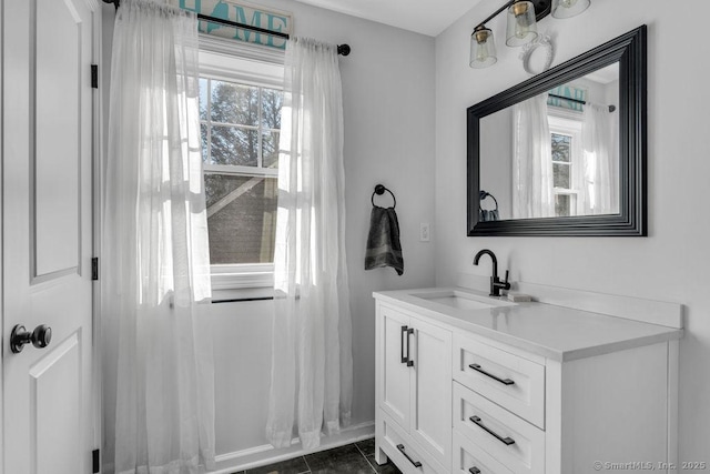 bathroom with tile patterned floors and vanity