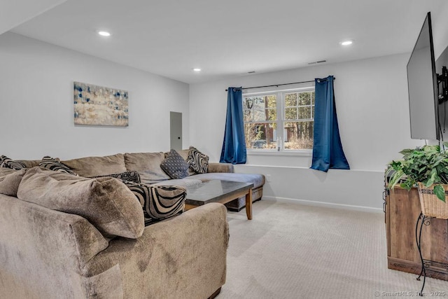 living room featuring recessed lighting, light colored carpet, visible vents, and baseboards