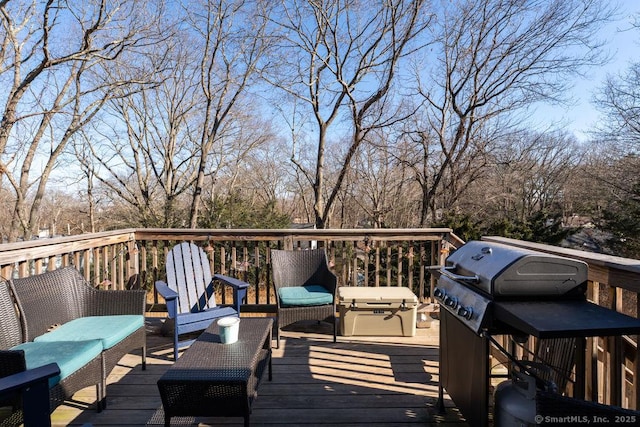 wooden deck featuring area for grilling