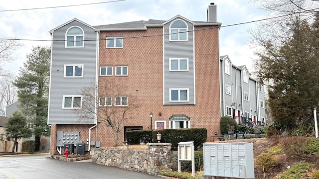 view of building exterior featuring central AC unit