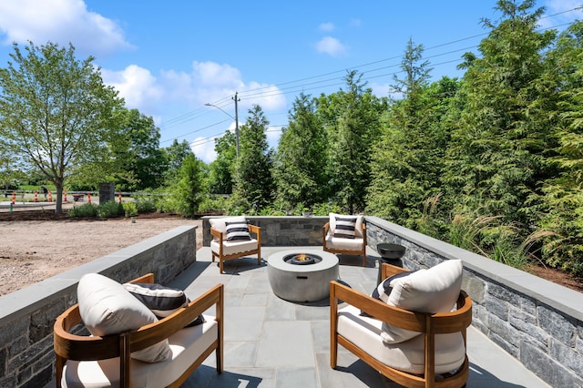 view of patio featuring a fire pit