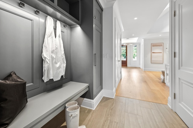 mudroom featuring light wood-type flooring, recessed lighting, and baseboards