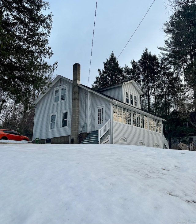 view of home's exterior with a chimney