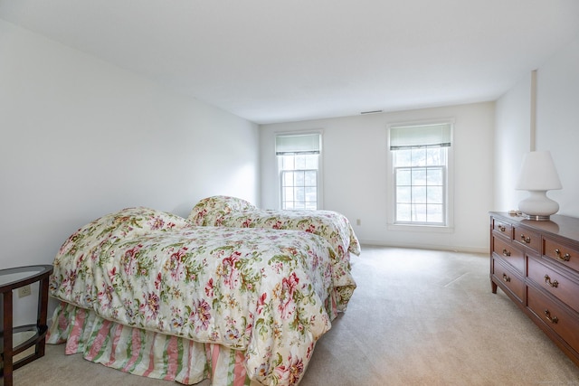 bedroom with light carpet