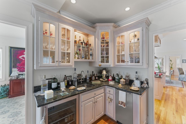 bar with wine cooler, a sink, light wood-style floors, wet bar, and crown molding