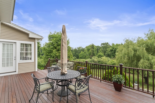 wooden deck with outdoor dining space