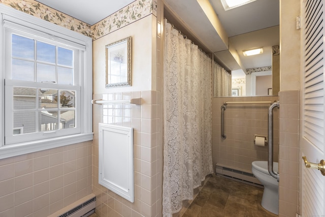 full bath with tile walls, a baseboard radiator, curtained shower, toilet, and a baseboard heating unit