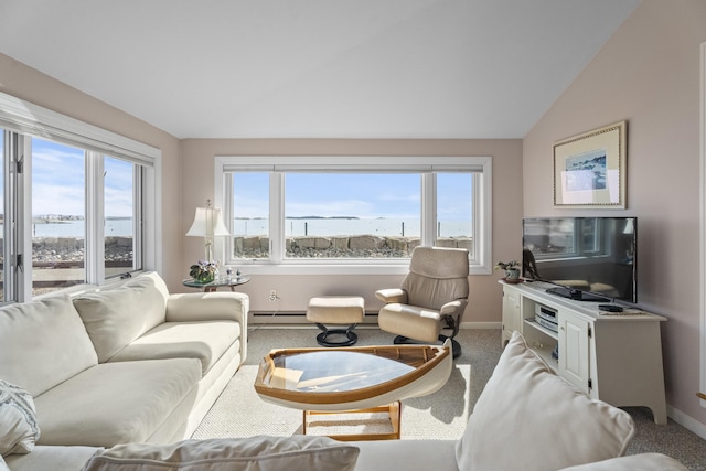 living area with vaulted ceiling, carpet flooring, plenty of natural light, and baseboards