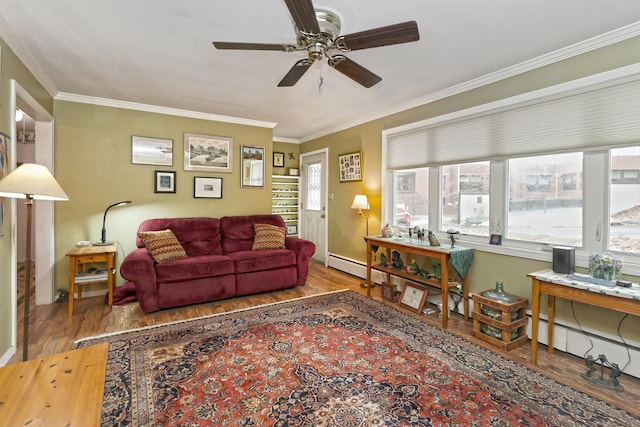 living area with ceiling fan, a baseboard radiator, wood finished floors, baseboards, and ornamental molding