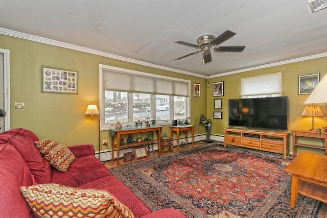 living area with baseboards, visible vents, a ceiling fan, baseboard heating, and crown molding