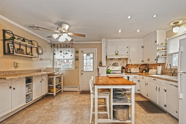 kitchen with open shelves, visible vents, baseboard heating, a sink, and white appliances